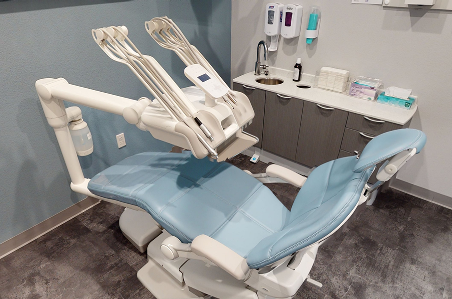 White and light blue dental exam chair