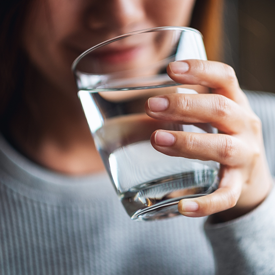 Woman holding a glass of water